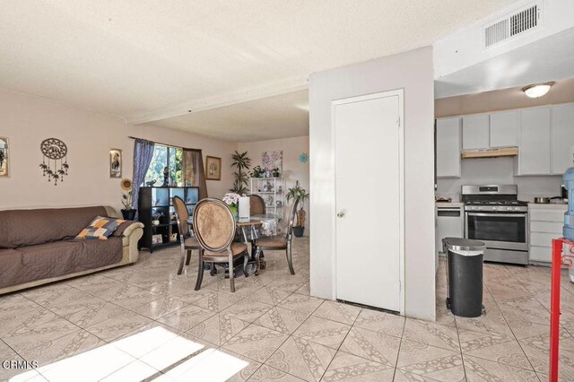 1431 Casa San Carlos Ln Unit A, Oxnard, CA 93033 - dining space with light tile patterned floors
