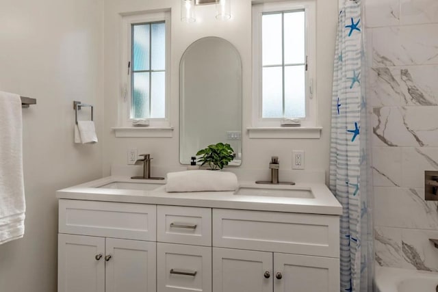 bathroom featuring vanity and shower / bath combo