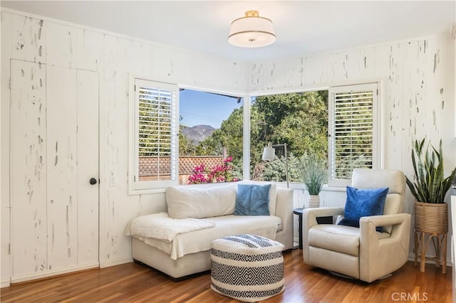 living area with hardwood / wood-style floors