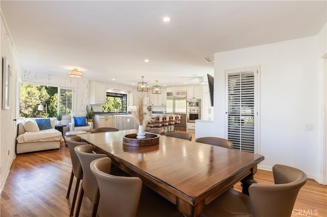 dining space featuring light hardwood / wood-style floors