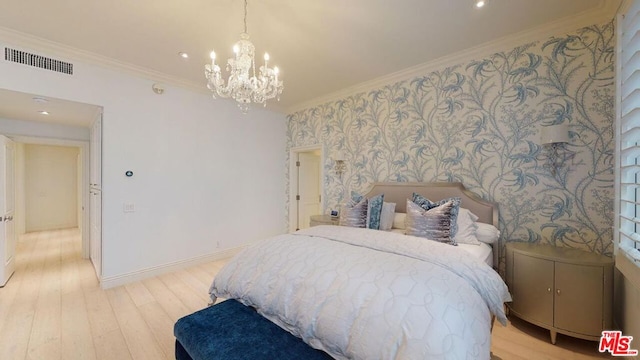 bedroom featuring a chandelier, light wood-type flooring, and ornamental molding