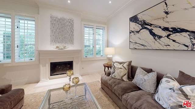 living room featuring a high end fireplace, light wood-type flooring, and ornamental molding