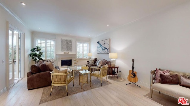 living room featuring ornamental molding and light wood-type flooring