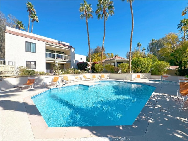 community pool featuring a patio