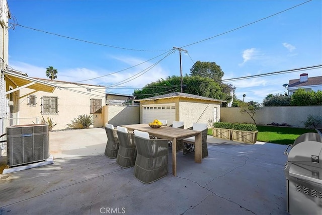 view of patio / terrace with an outbuilding, a garage, grilling area, and central air condition unit