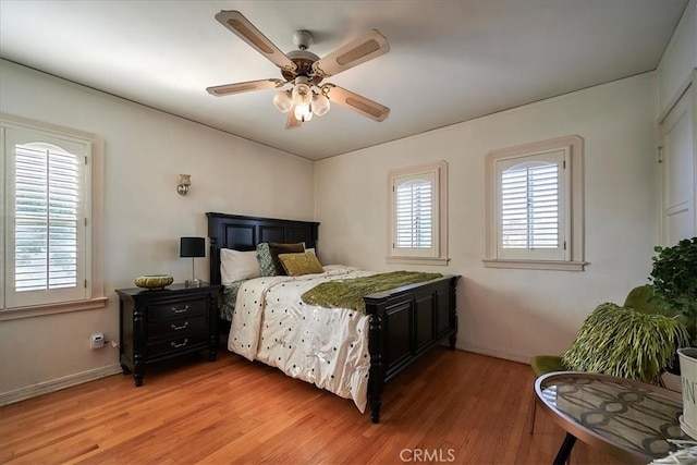 bedroom featuring hardwood / wood-style flooring and ceiling fan