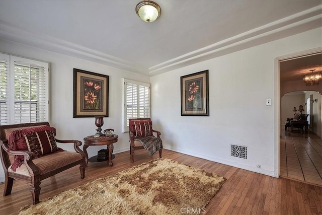 living area featuring plenty of natural light and wood-type flooring