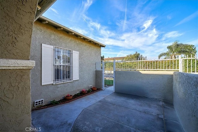 view of side of property with a patio