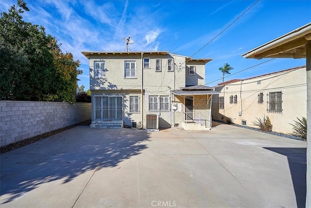 back of house with a patio and central AC unit