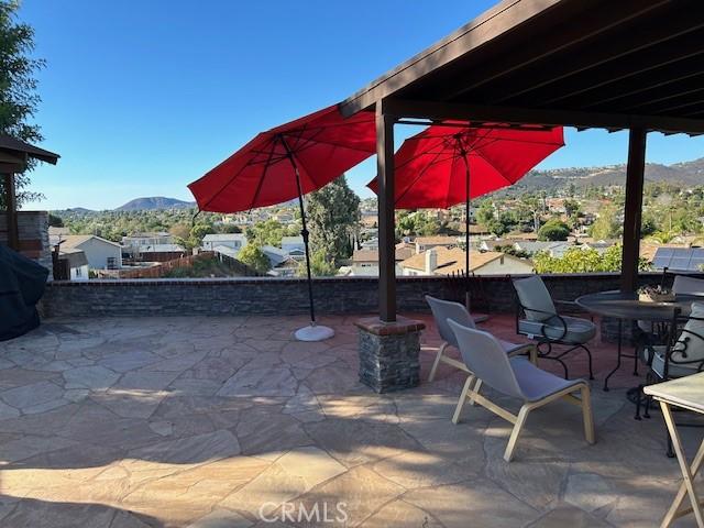 view of patio / terrace featuring a mountain view