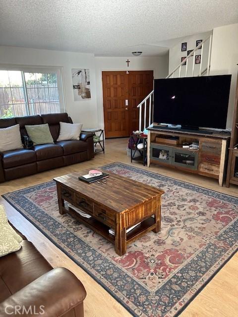 living room featuring a textured ceiling