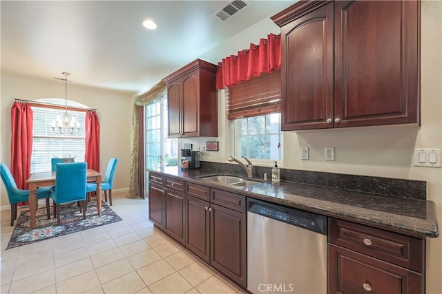 kitchen featuring dishwasher, decorative light fixtures, plenty of natural light, and a notable chandelier