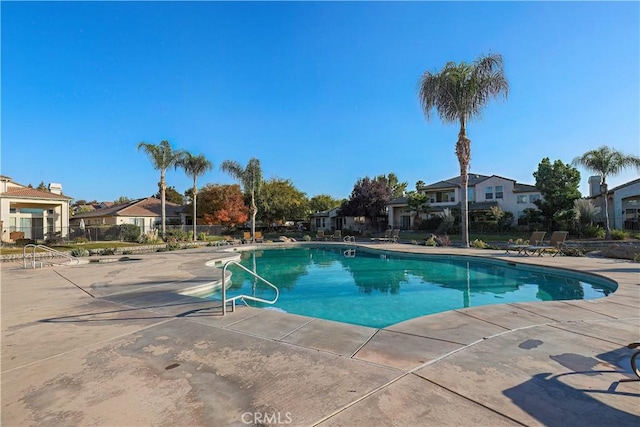 view of swimming pool featuring a patio