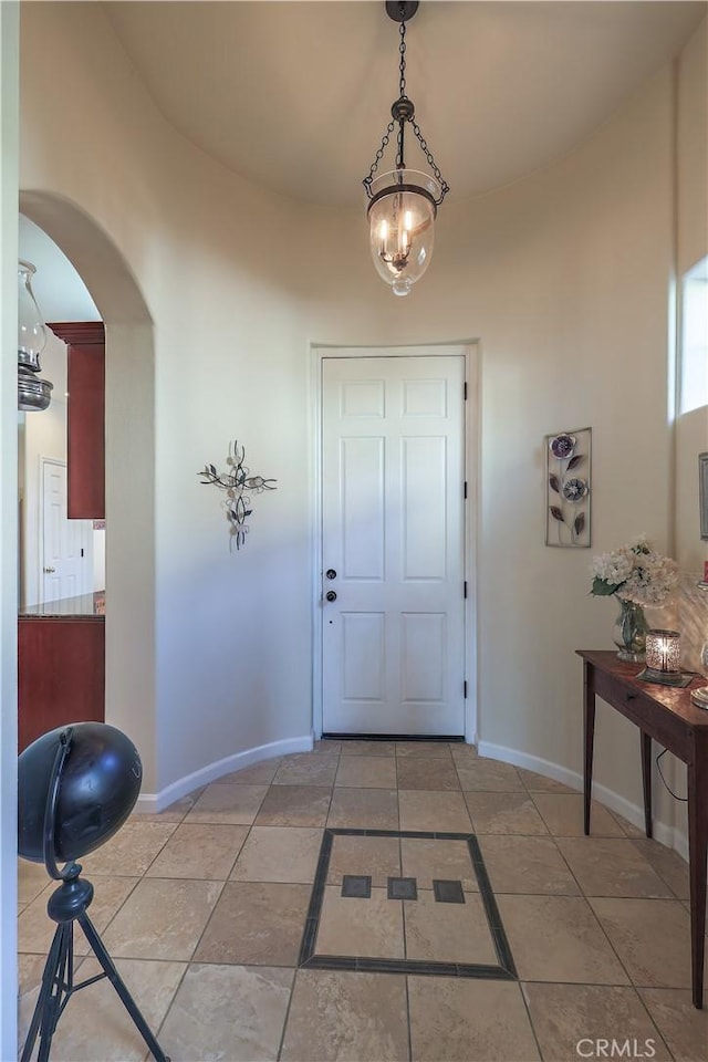 foyer with a chandelier