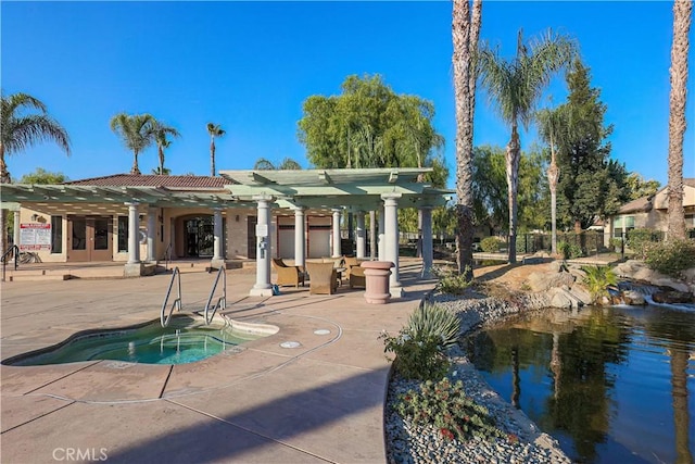 view of swimming pool featuring a pergola, a patio area, and a hot tub