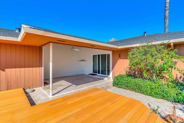 exterior space with ceiling fan and a patio