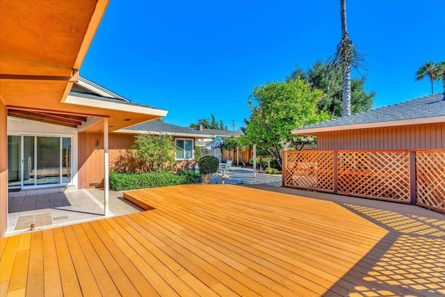 wooden terrace with a patio