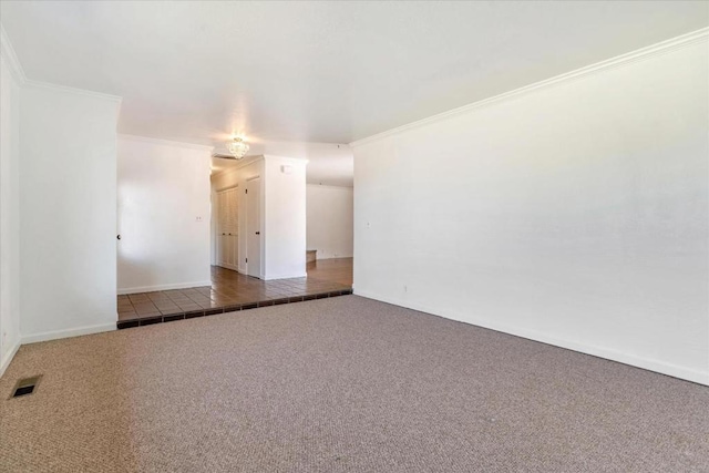 carpeted spare room with ornamental molding