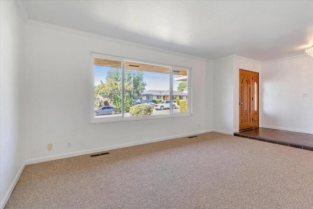 unfurnished room featuring carpet and crown molding