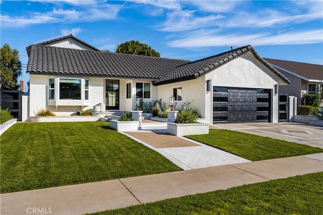 view of front of property with a front lawn and a garage