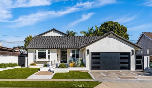 view of front facade with a front yard and a garage