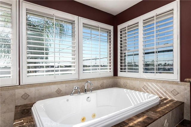 bathroom featuring tiled bath