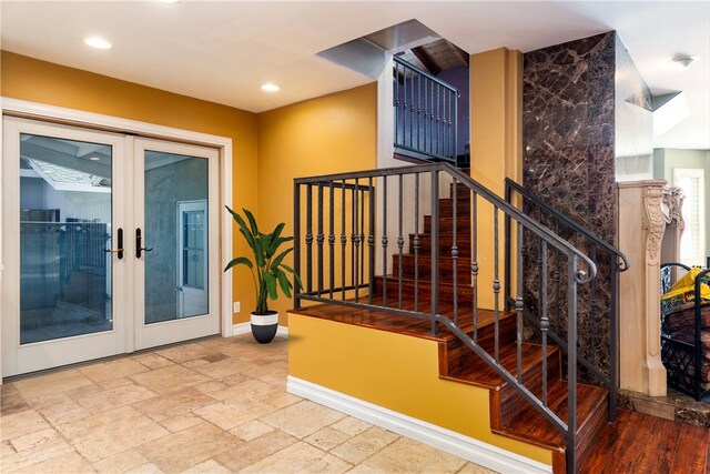 stairs with french doors