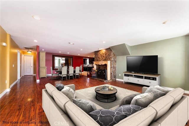 living room featuring dark hardwood / wood-style flooring