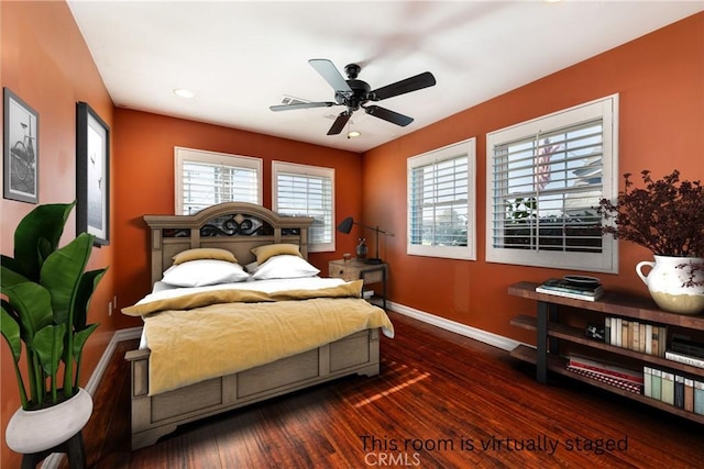 bedroom with ceiling fan and dark hardwood / wood-style floors