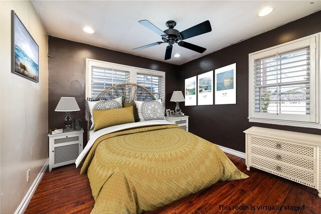 bedroom featuring ceiling fan, dark hardwood / wood-style flooring, and radiator