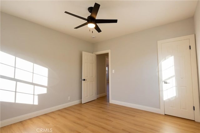 spare room featuring ceiling fan and light hardwood / wood-style floors