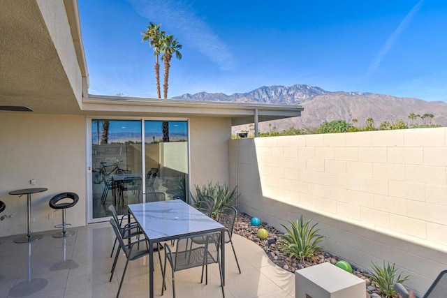 view of patio / terrace featuring a mountain view