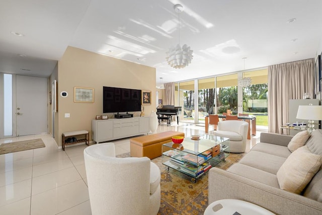 tiled living room featuring a chandelier