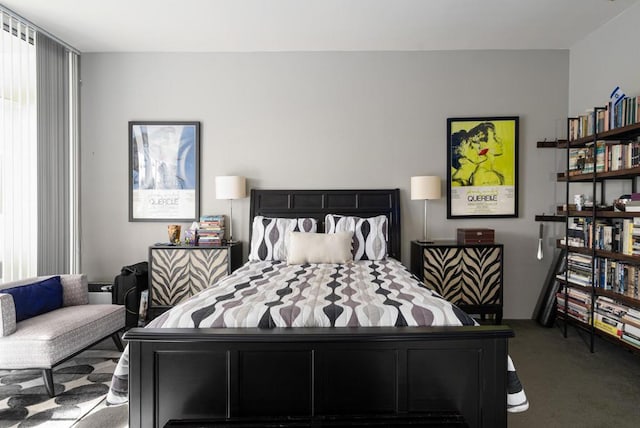 bedroom featuring dark colored carpet