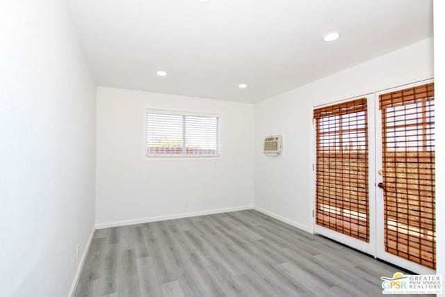 spare room featuring light hardwood / wood-style floors