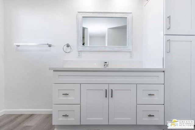 bathroom with vanity and hardwood / wood-style flooring