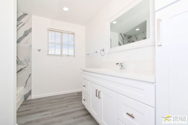 bathroom featuring vanity and wood-type flooring