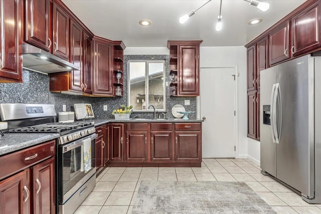 kitchen featuring light tile patterned floors, decorative backsplash, sink, and appliances with stainless steel finishes