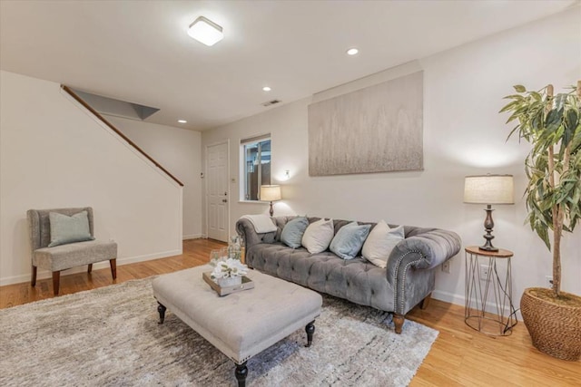 living room with light hardwood / wood-style floors