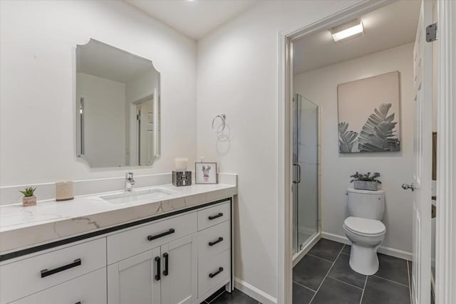 bathroom with vanity, a shower with shower door, tile patterned floors, and toilet