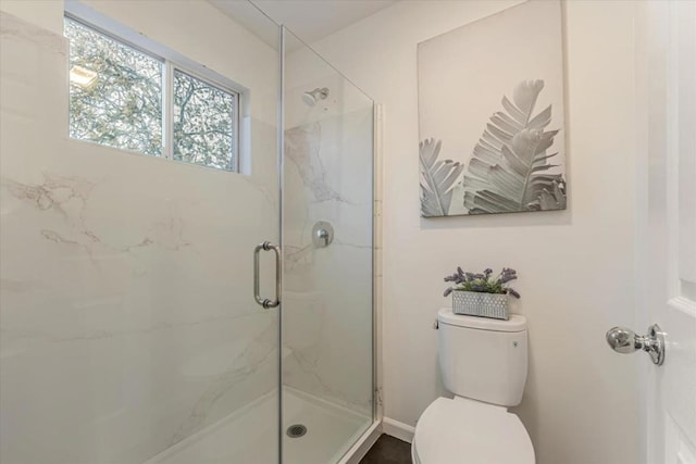 bathroom with toilet and walk in shower