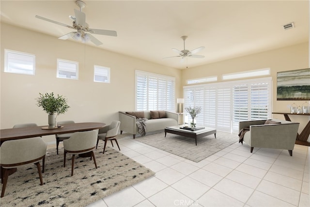 tiled living room featuring ceiling fan