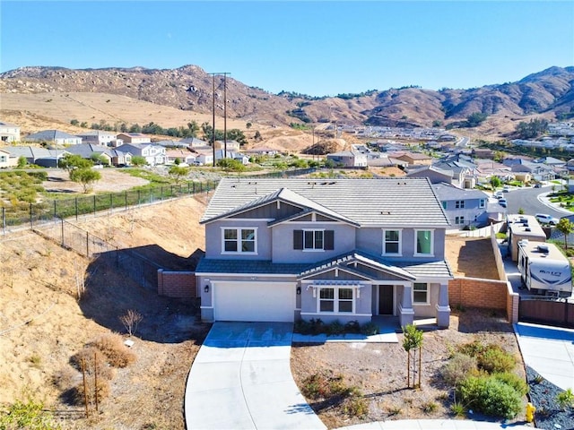 view of front of house with a mountain view and a garage