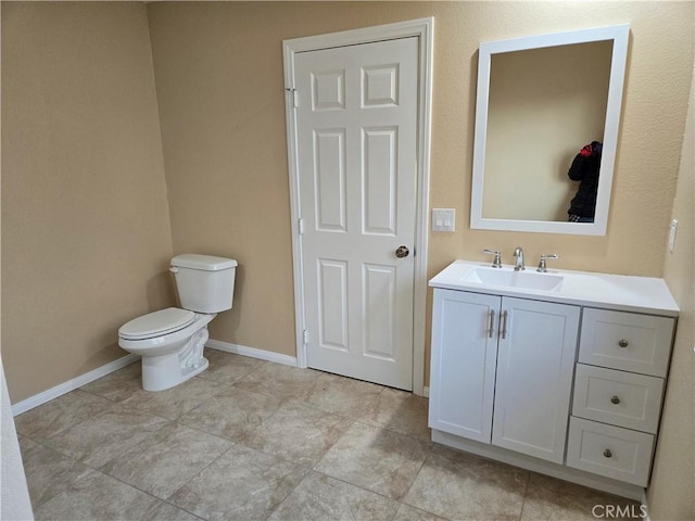 19345 Oneida Rd, Apple Valley, CA 92307 - half bathroom with toilet, vanity, and baseboards