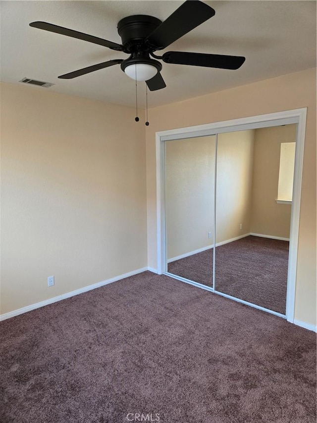19345 Oneida Rd, Apple Valley, CA 92307 - unfurnished bedroom featuring carpet flooring, a closet, baseboards, and ceiling fan