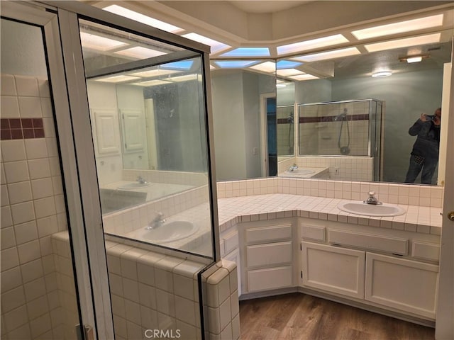 19345 Oneida Rd, Apple Valley, CA 92307 - full bath featuring vanity, wood finished floors, and a stall shower