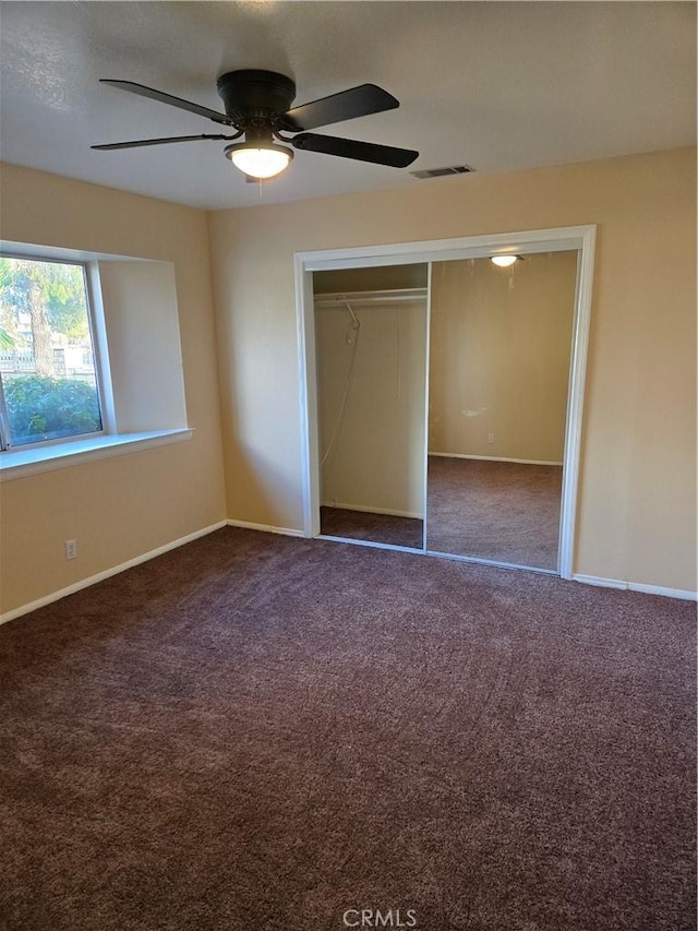 19345 Oneida Rd, Apple Valley, CA 92307 - unfurnished bedroom with carpet, baseboards, a closet, and ceiling fan