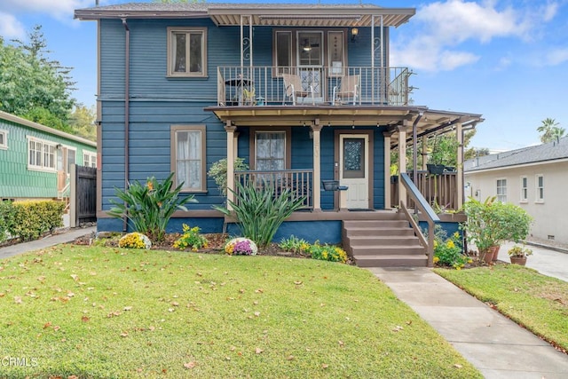 view of front of home with a porch and a front lawn