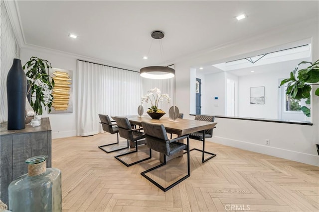 dining room featuring light parquet floors and crown molding