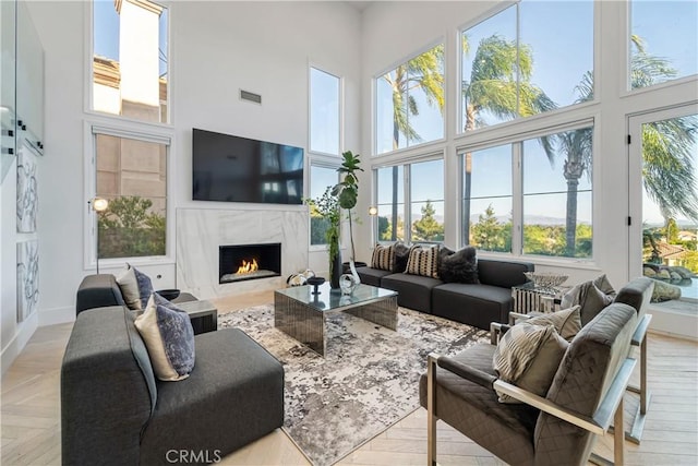 sunroom / solarium with a fireplace and a healthy amount of sunlight